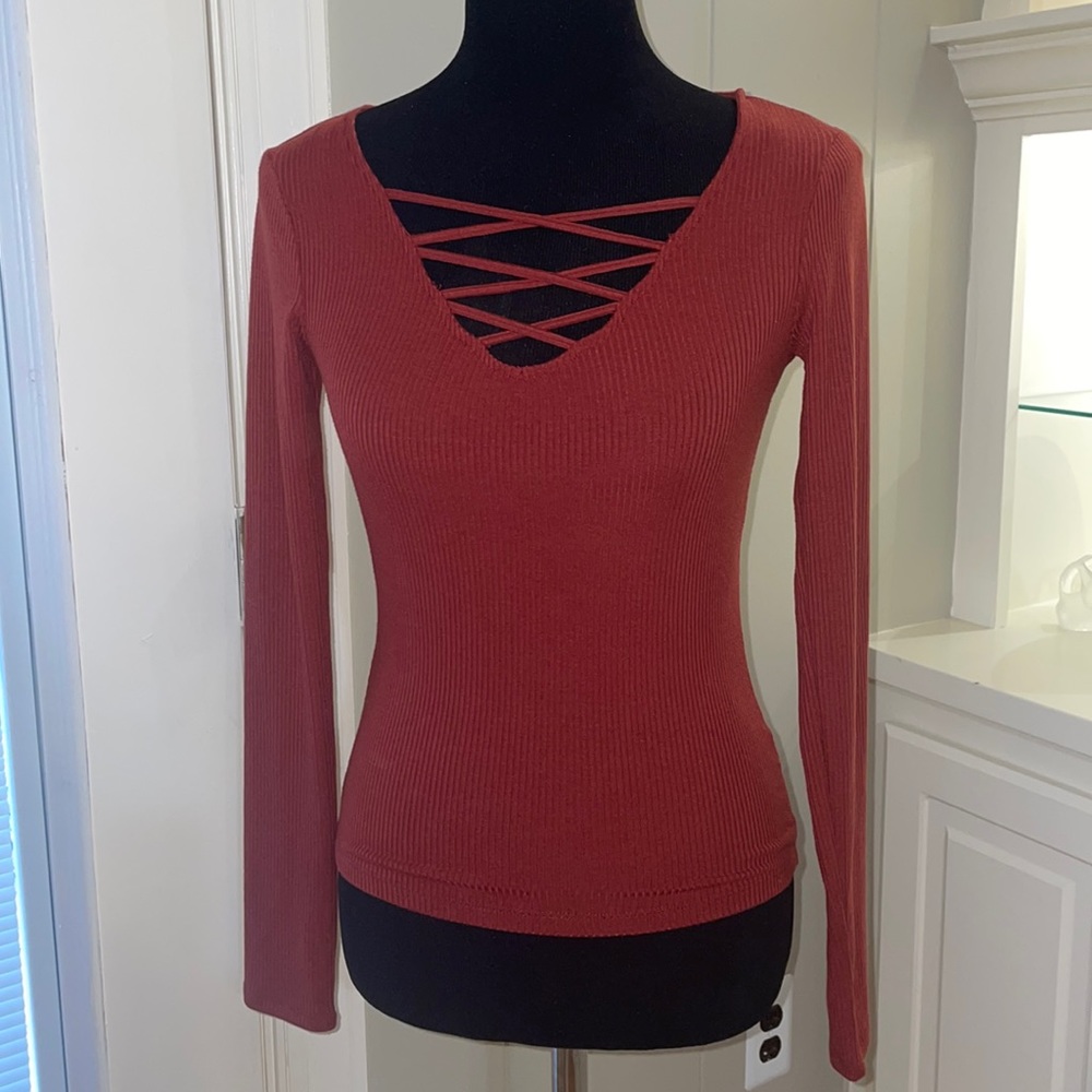 SERIOUSLY SOFT AERO burgundy sweater. Size small. V-neck with crisscross straps.
